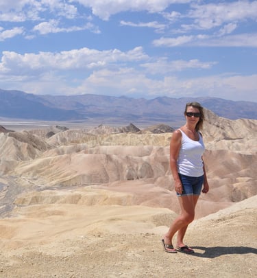 a woman standing at zabreski point, death valley
