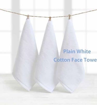 three white cotton face towels hanging on a clothes line