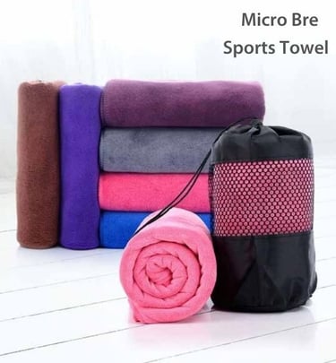 a micro bre hand towel with black bag on white floor