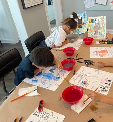 Children focused on drawing colorful artwork