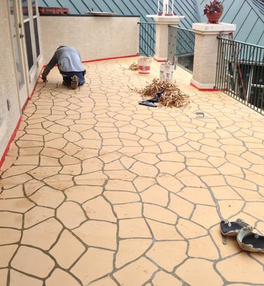 Stenciled concrete surface on baloney.