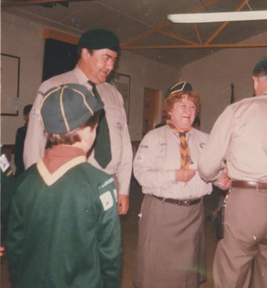 cub and scouts leaders in a hut