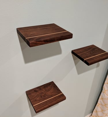 custom walnut floating shelves with maple band inlay for bedroom