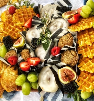 a brunch platter of waffles, fruit & patries