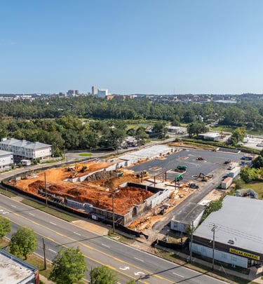 a large building with a lot of construction materials and a lot of construction equipment