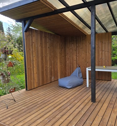 a patio with a bean bag on the deck