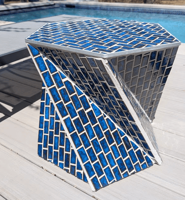 blue poolside tile table in sunlight