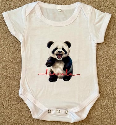 White baby onesie with a baby panda & personalized with child's name.