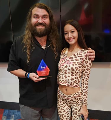 Award recipient recognized at a Fear Fame Arts Foundation supported event.