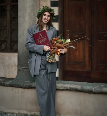 a woman in a suit and a flower crown