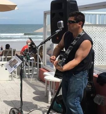 Thom Blasberg playing guitar and singing in Ormond Beach FL
