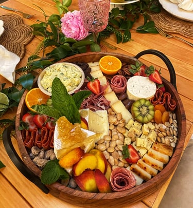 a platter of fruit and cheese