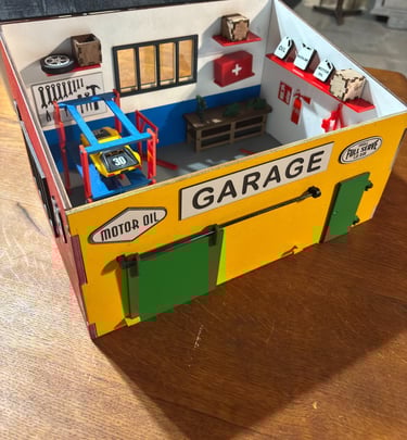 a toy garage with a garage and tools, diorama