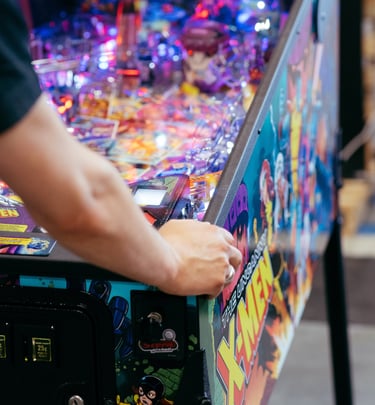 A pinball machine is being played