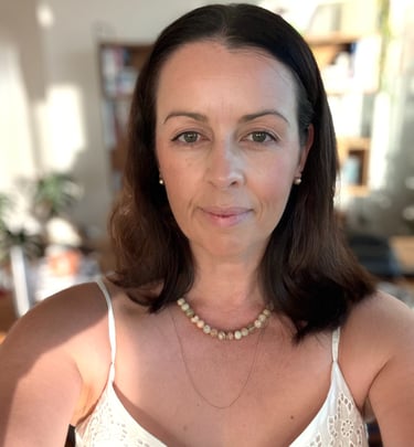 Brisbane-based photographer and content creator in a relaxed natural-light setting