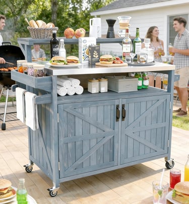 Rustic blue outdoor kitchen prep station with stainless steel top at a backyard BBQ party.