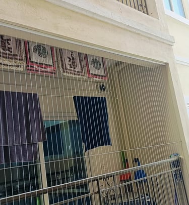 View from inside a Bengaluru apartment showing clear, unobstructed balcony views through subtle gril