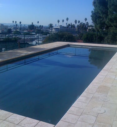 a pool with a view of a city skyline