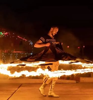 Traditional fire performance at a Dubai desert safari camp during evening entertainment