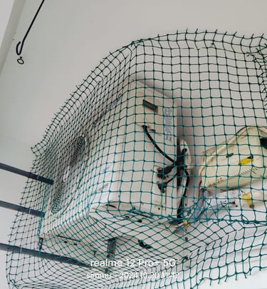 Close-up of a securely installed balcony safety net with sunlight filtering through