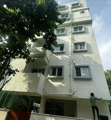 Apartment exterior showing multiple ducts protected with neatly installed nets