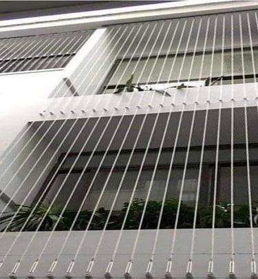 Installation process of invisible grills on a residential building in Kodambakkam