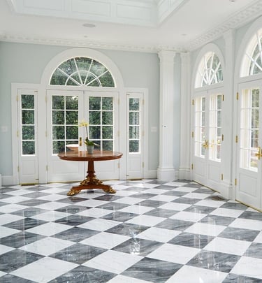 a room with a table and chairs and a table