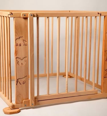 a wooden baby gated in a wooden fenced in area