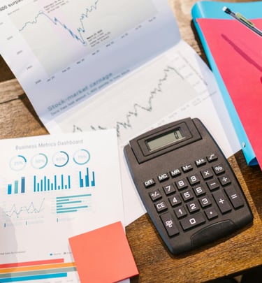 a calculator and a graph on a table