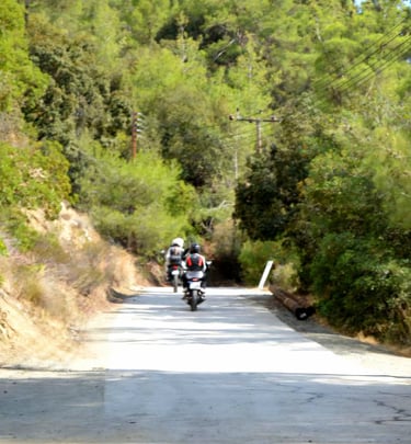 a person riding a motorcycle down a road, during our Cyprus photography tour