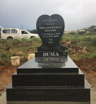 Baby grave, heart headstone with double kerbs and slab, polished all round