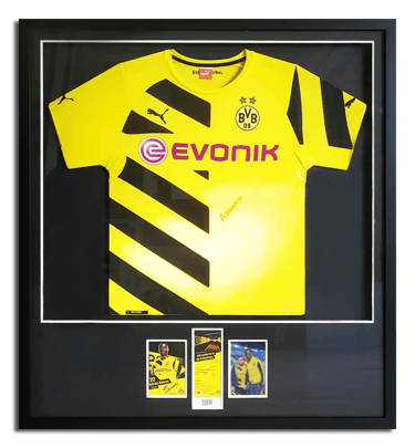 A framed featuring a signed Borussia Dortmund jersey