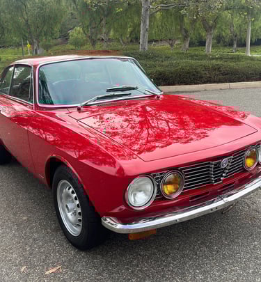 An image of a red 1974 Alfa Romeo GTV 2000