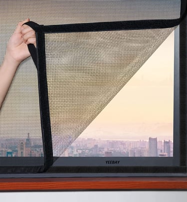 A balcony door secured with a custom mosquito net, blending seamlessly with the home’s design