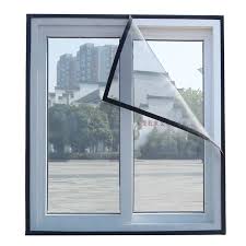 Technician from Arjilli Safety Nets carefully measuring a window frame before installation