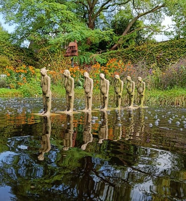 Row of small statues in a pond