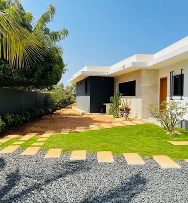 a house with a lawn and a small garden