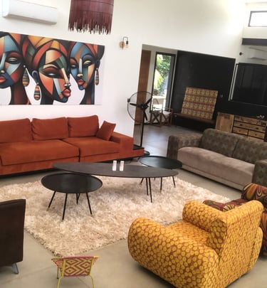 a living room with a couch and a painting