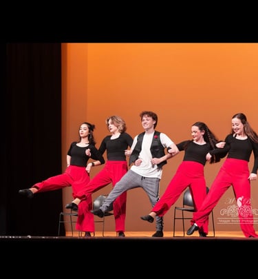 a group of teens tap dancing on a stage