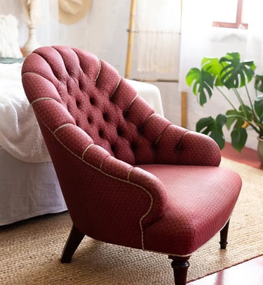 a chair with a red chair and a hat on it