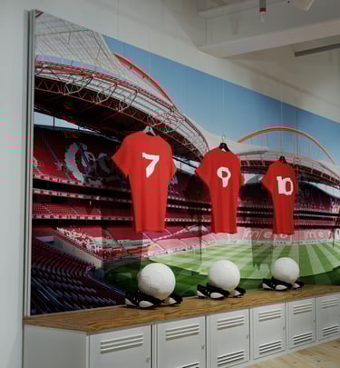 Large tension fabric wall graphic installation with counters below.