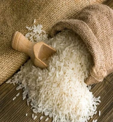 white basmati rice grains spilling from a burlap sack