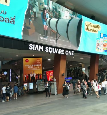 a group of people walking through a mall