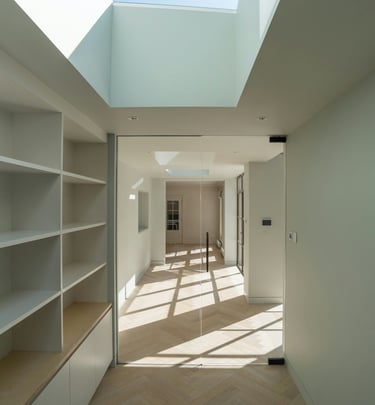 a room with a skylight and a wooden floor
