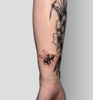 a bee on a man's arm with a bee on it