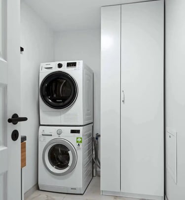 Laundry machines in an our adult family home, laundry room for resident clothing care and daily living support