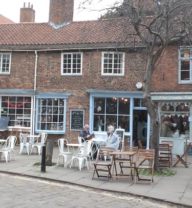 city scene in york of a pavement cafe
