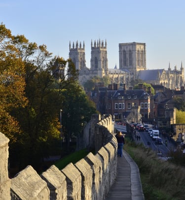 image of the city of York taken from the city walls. You can walk along the top of the wall