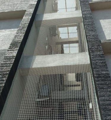 Close-up of the durable net material used for pigeon protection in residential buildings
