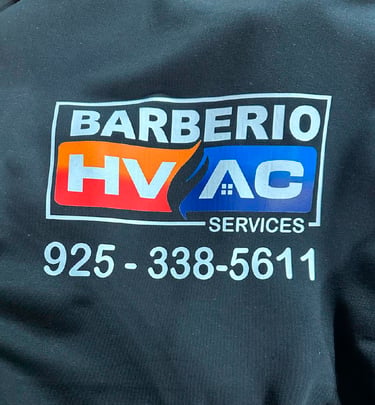 Barberio HVAC Services logo on black fabric with phone number for heating and cooling repair.